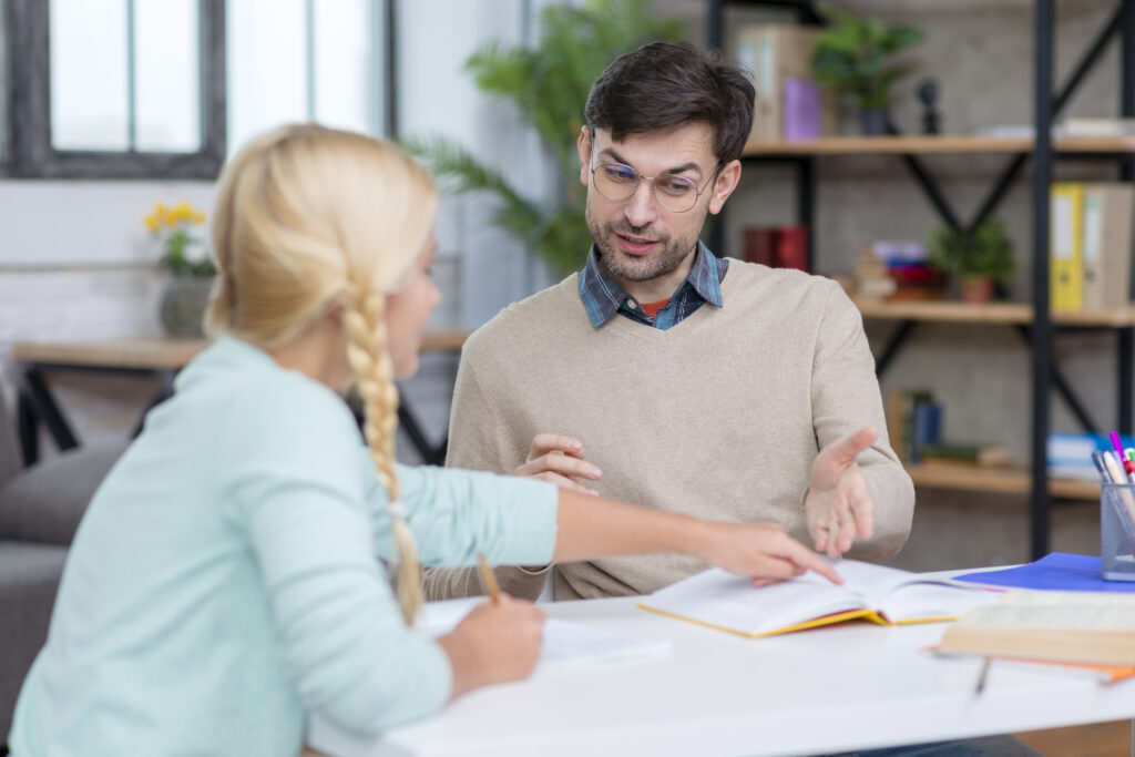 young girl student explaining teacher